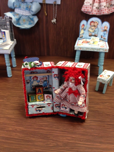 Raggedy Ann in a trunk