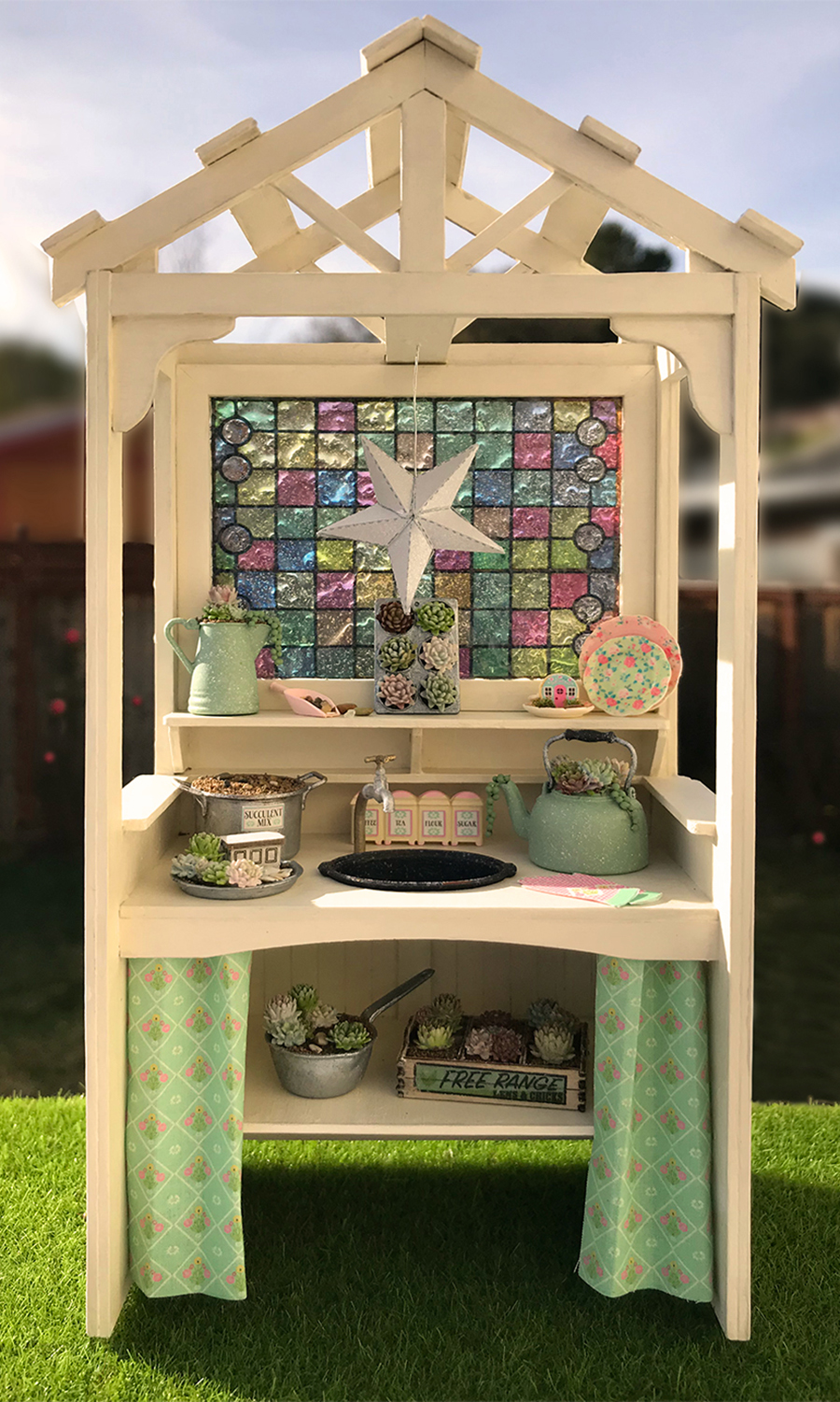 photo of succulents and potting bench